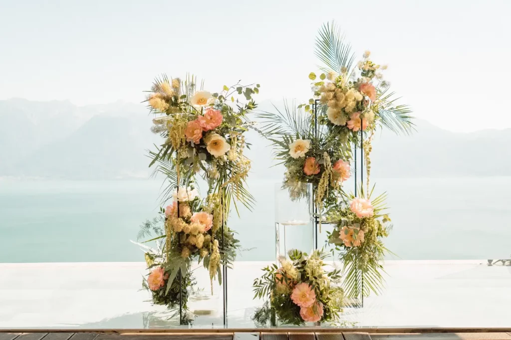 Floral arch for a wedding ceremony on Le Deck terrace