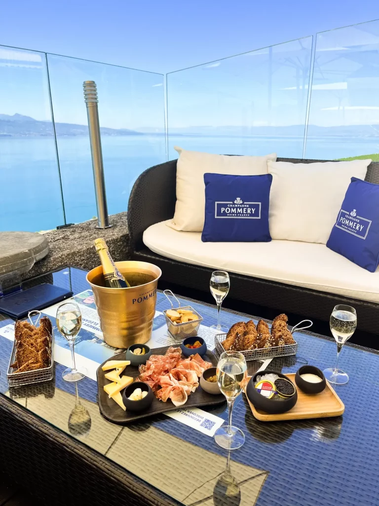 Pommery VIP Table with champagne on Le Deck terrace
