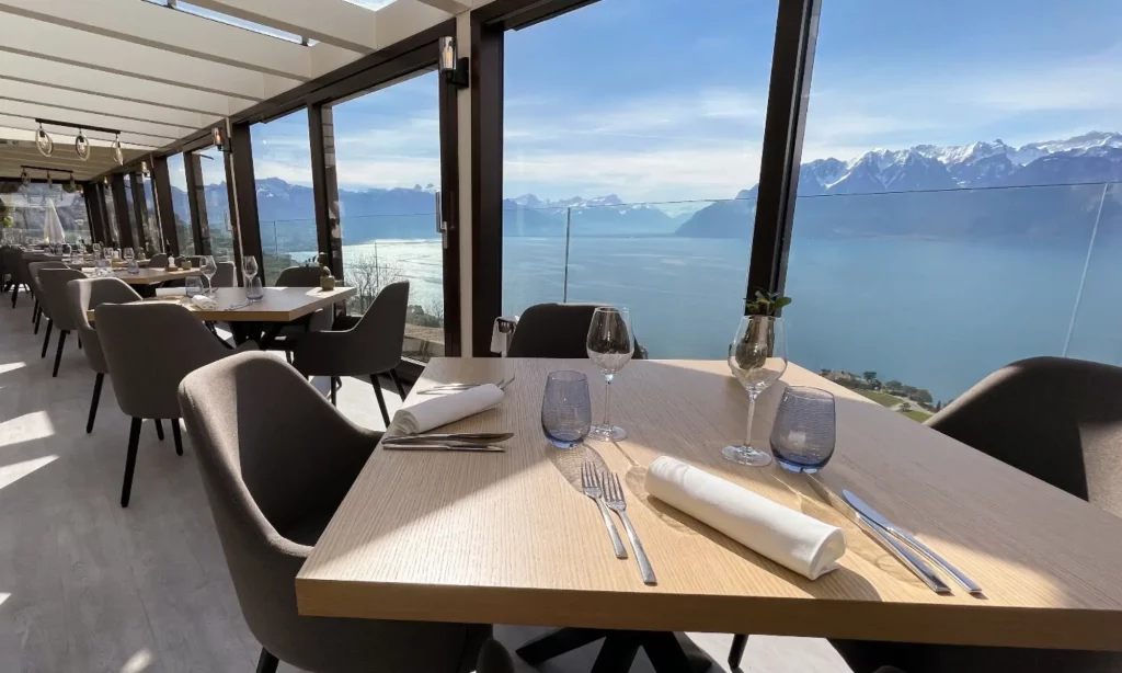 Table set at Le Deck gastronomic restaurant above Lake Geneva